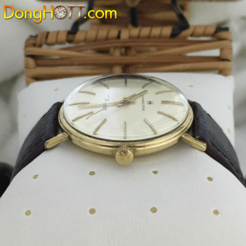 Đồng hồ cổ Hamilton thin-o-matic xuất sứ Thụy Sĩ với mặt số zin màu trắng rất đẹp, 3kim, nút(có logo)-vỏ bọc vàng toàn thân.